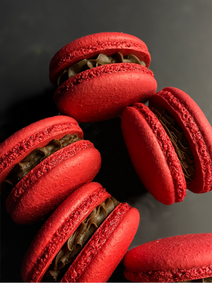 Dark chocolate and raspberry flavored macarons